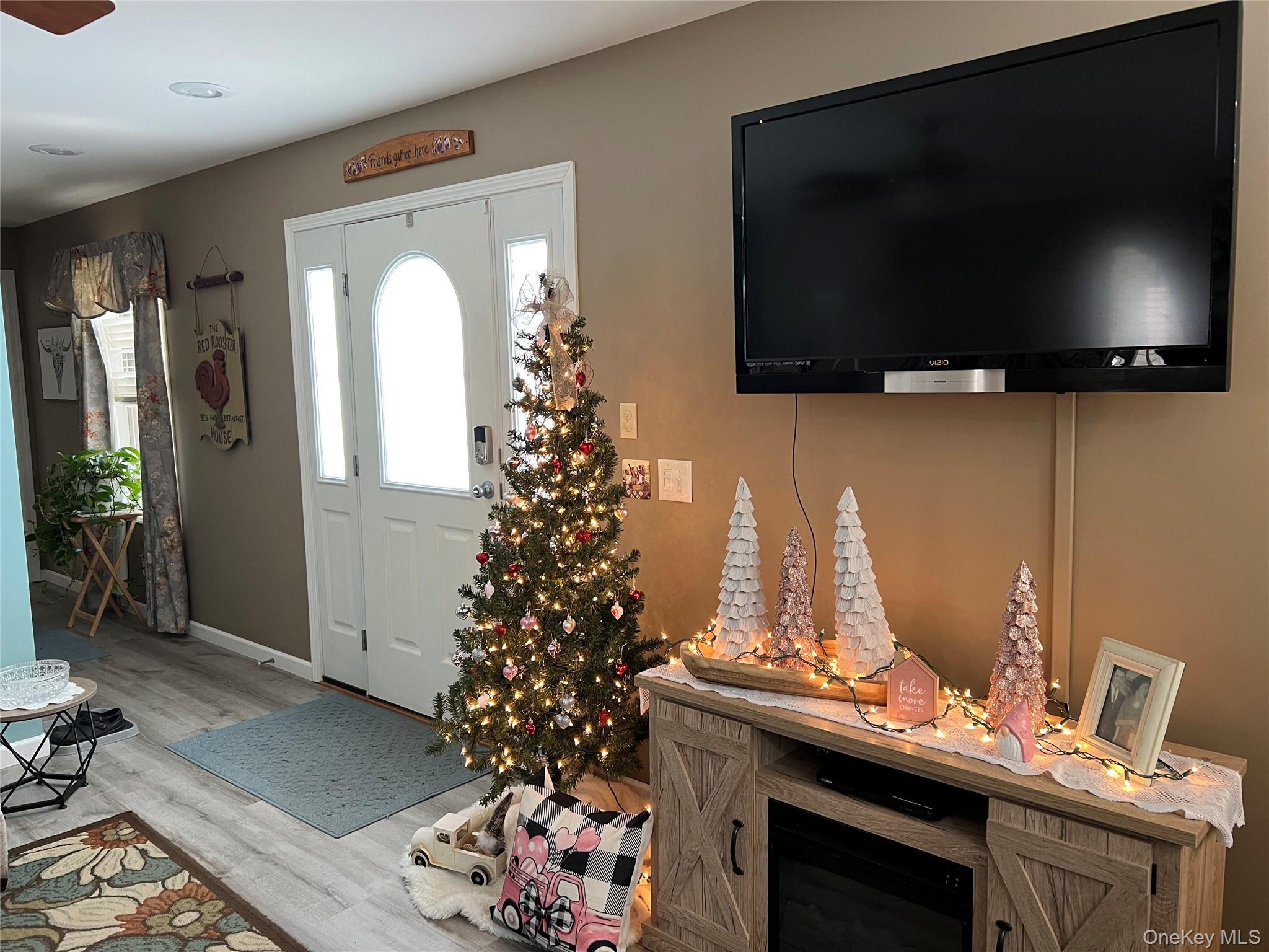 71 Midway Road Liberty, NY 12758 - Photo 9 of 23 a living room with a flat screen tv and a christmas tree