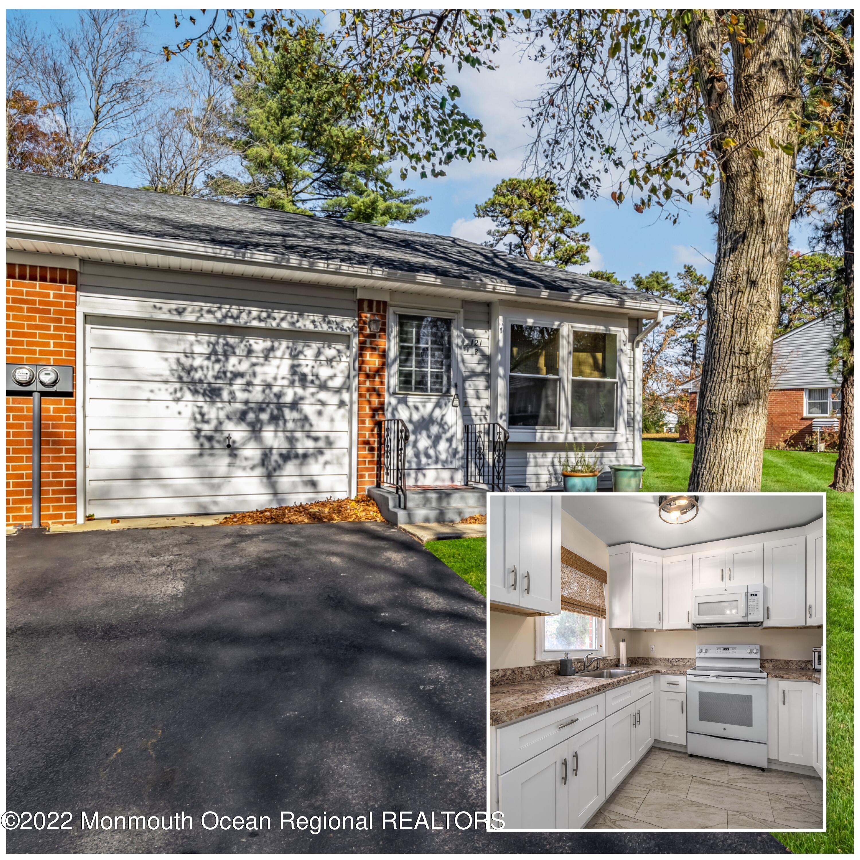 a view of living room filled with furniture and a fireplace