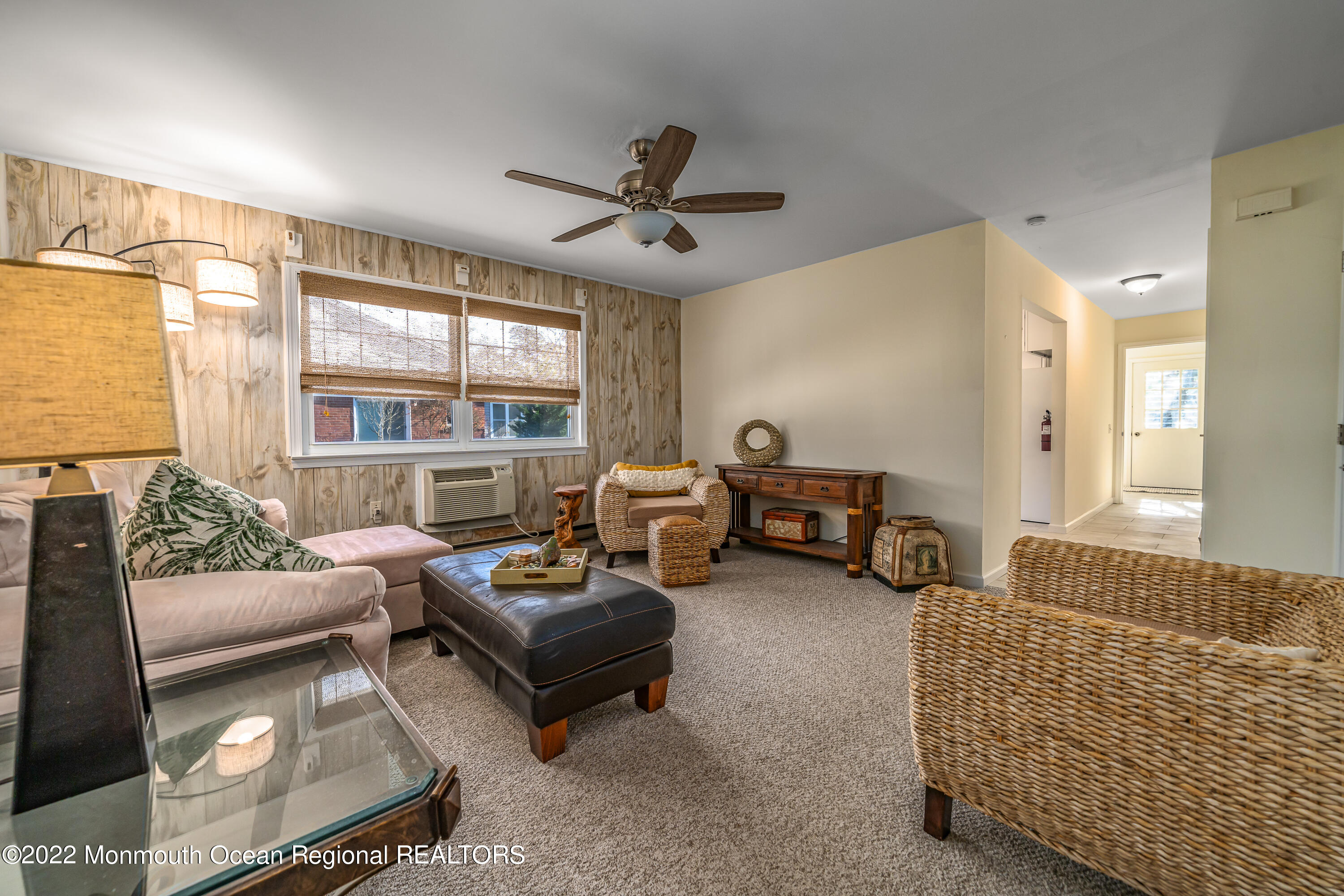121 Constitution Boulevard, Unit B Whiting, NJ 08759 - Photo 11 of 20 a living room with furniture and a large window