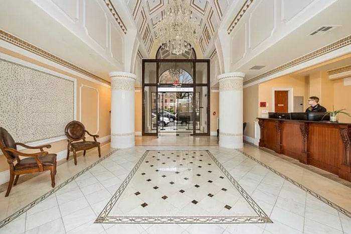 63-36 99th Street, Unit 8E Queens, NY 11374 - Photo 15 of 19 a living room with a rug and a table