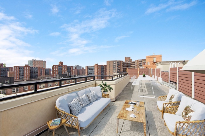 63-36 99th Street, Unit 8E Queens, NY 11374 - Photo 17 of 19 a view of roof deck with city view and wooden floor