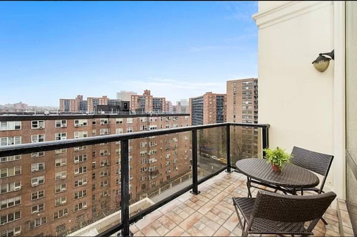 63-36 99th Street, Unit 8E Queens, NY 11374 - Photo 5 of 19 a view of a balcony with two chairs and a table