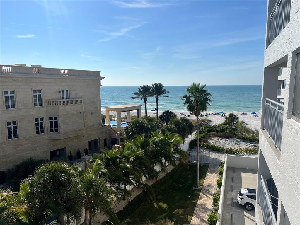 aerial view of a house with a yard and potted plants