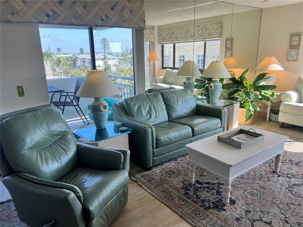 1001 Point Of Rocks Road, Unit 508 Sarasota, FL 34242 - Photo 2 of 34 a living room with furniture and a large window