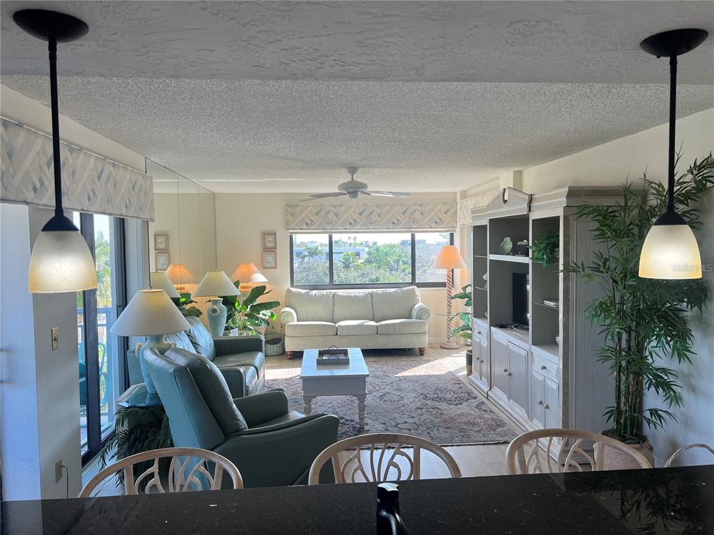 1001 Point Of Rocks Road, Unit 508 Sarasota, FL 34242 - Photo 8 of 34 a living room with furniture and a large window