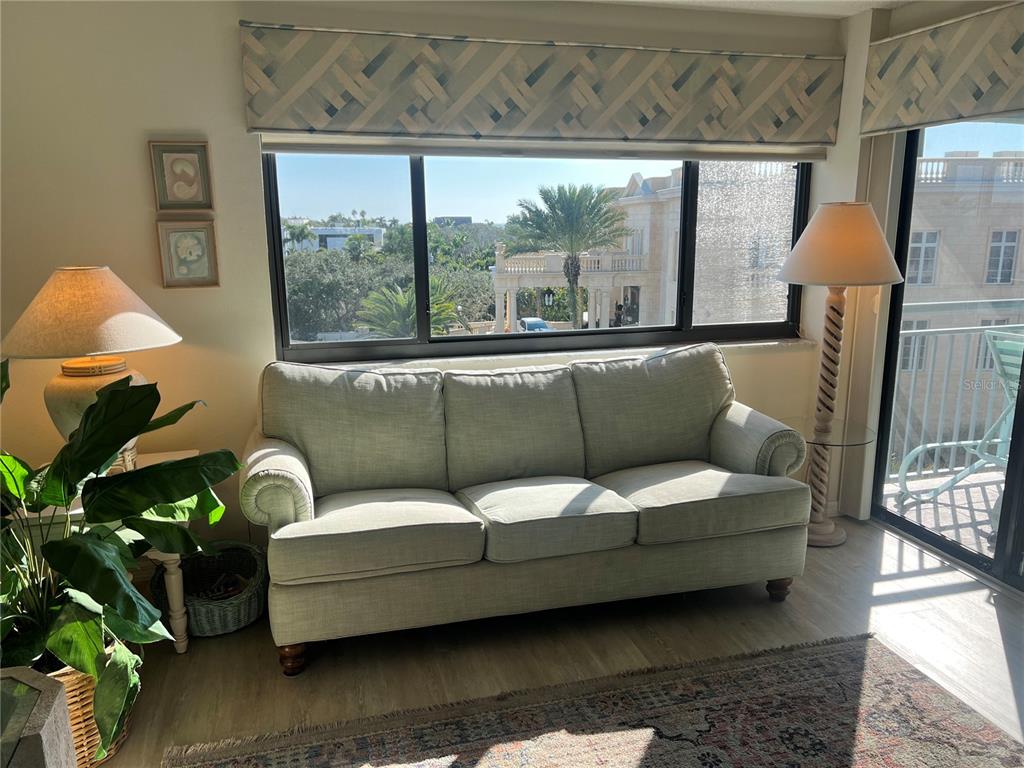 1001 Point Of Rocks Road, Unit 508 Sarasota, FL 34242 - Photo 10 of 34 a living room with furniture and a window
