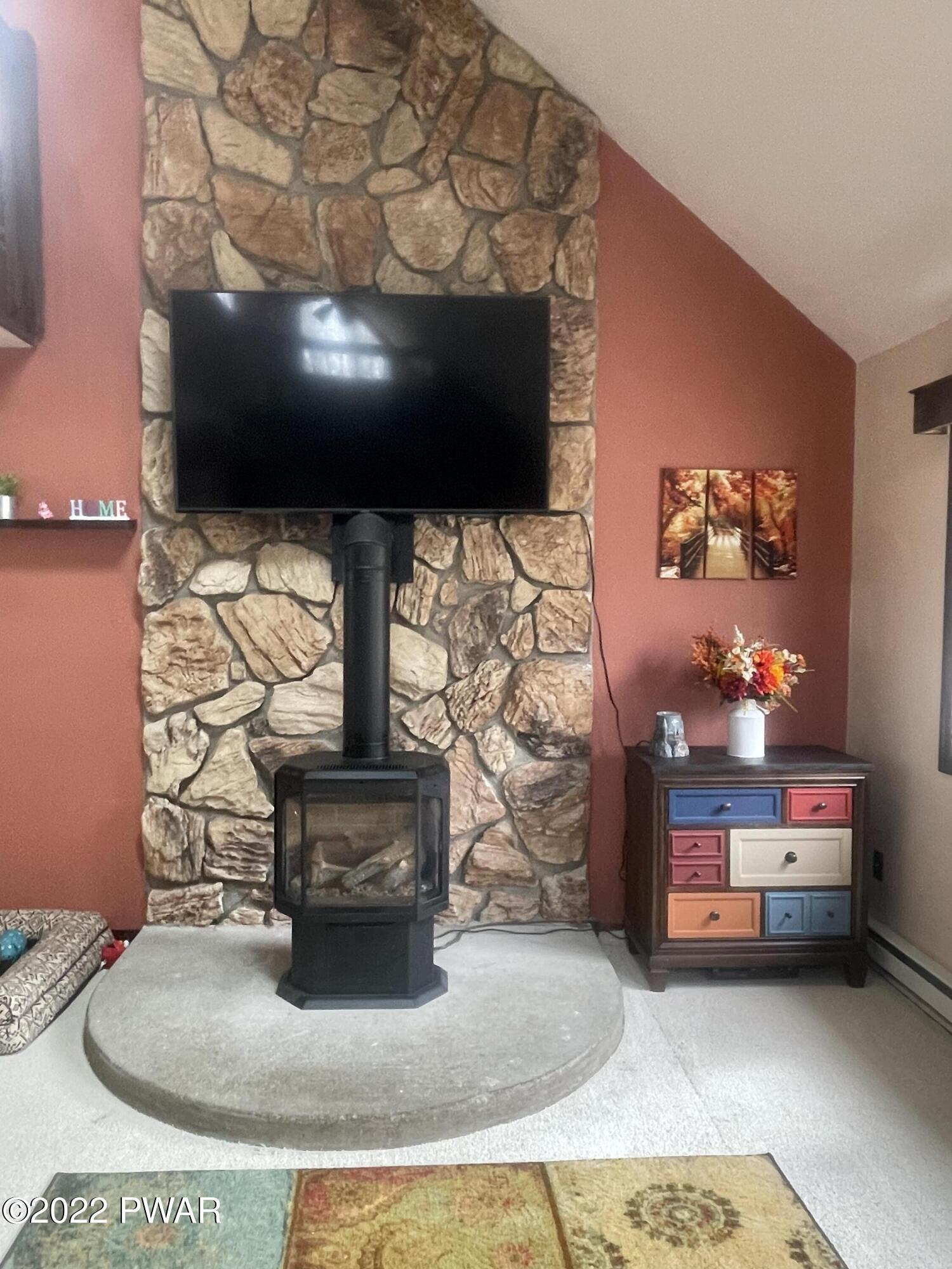 149 Rodeo Drive Hawley, PA 18428 - Photo 17 of 34 a living room with furniture and a flat screen tv