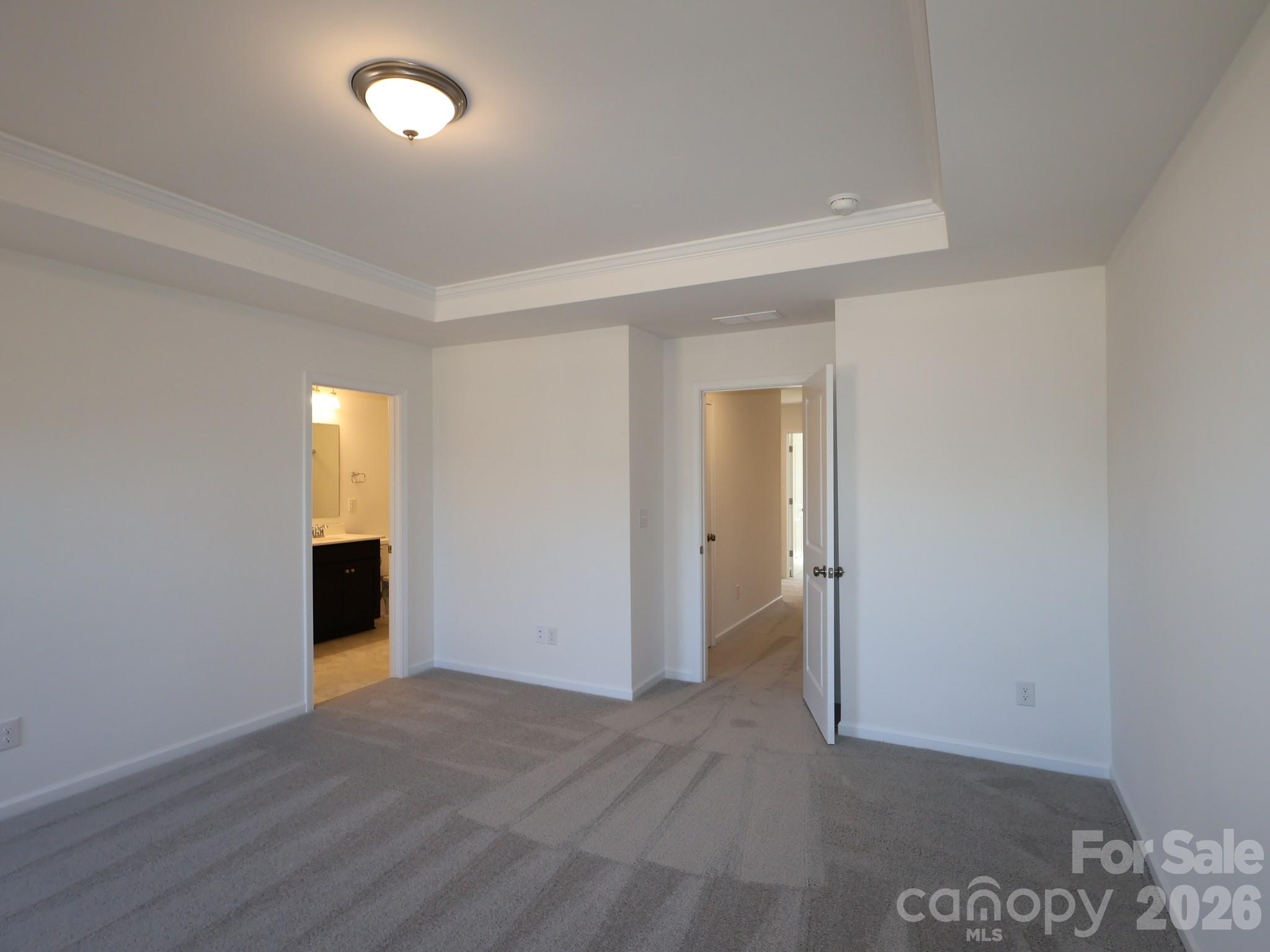 1152 Overbrook Place Wingate, NC 28174 - Photo 15 of 19 an empty room with wooden floor and windows