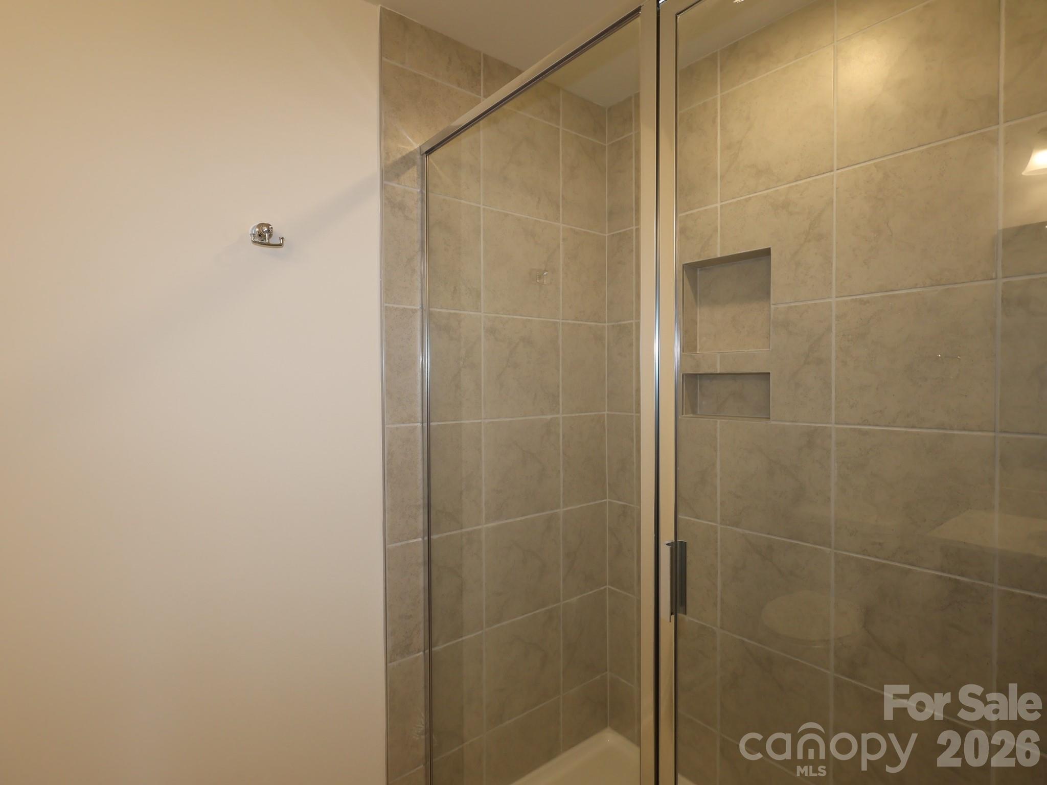 1152 Overbrook Place Wingate, NC 28174 - Photo 18 of 19 a bathroom with a shower