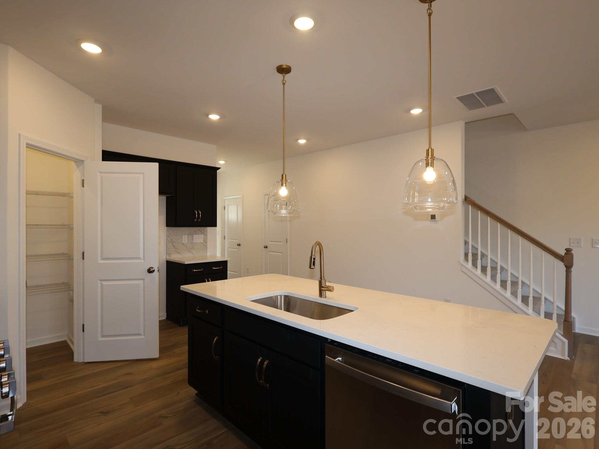 1152 Overbrook Place Wingate, NC 28174 - Photo 3 of 19 a bathroom with a sink a shower and a mirror