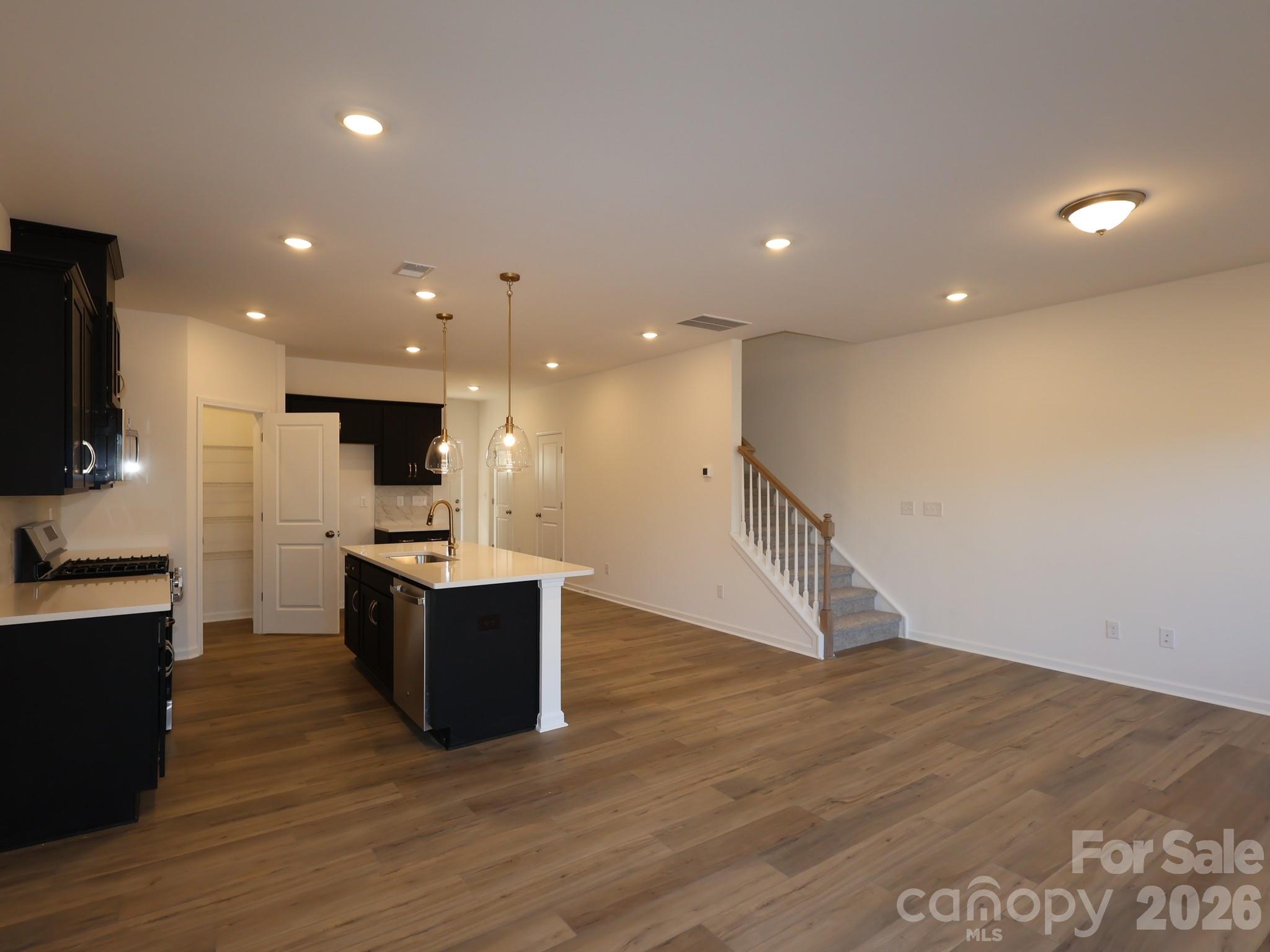 1152 Overbrook Place Wingate, NC 28174 - Photo 6 of 19 a view of kitchen with microwave and stove