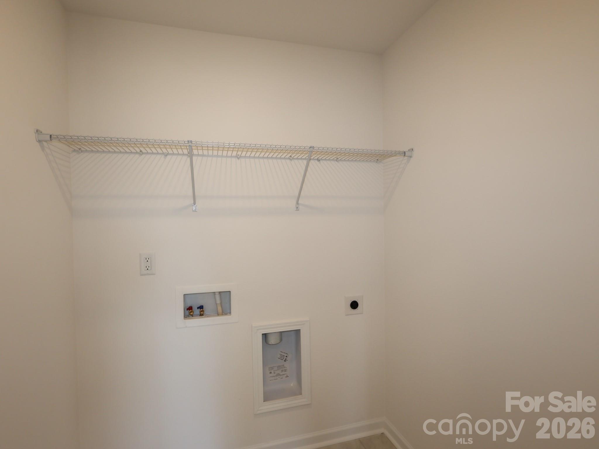 1152 Overbrook Place Wingate, NC 28174 - Photo 9 of 19 a view of small space with empty racks on the wall