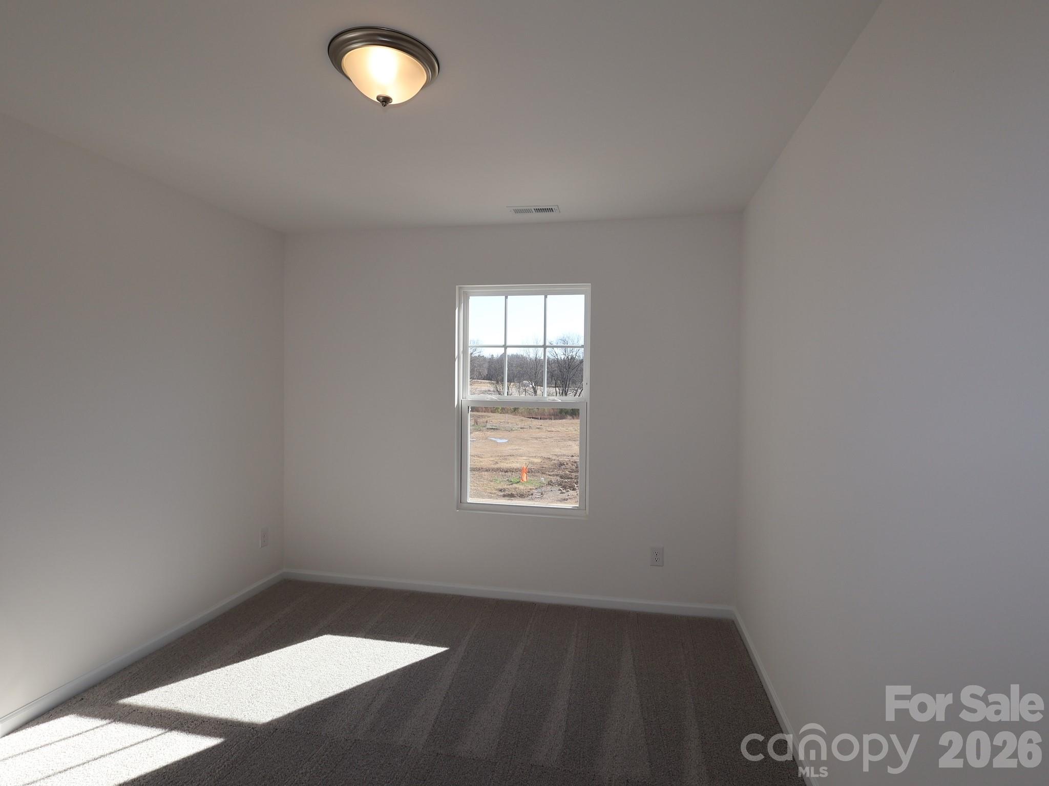 1152 Overbrook Place Wingate, NC 28174 - Photo 10 of 19 an empty room with a window