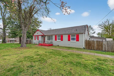 a front view of house with yard and seating area