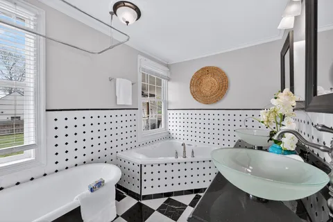 a bathroom with a sink toilet and a mirror