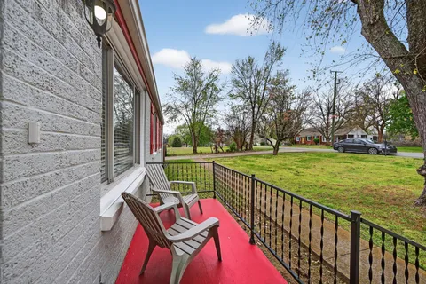 a view of a deck with a yard