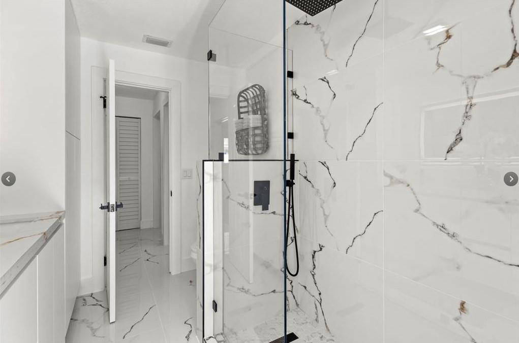 1365 Southwest 14th Street Boca Raton, FL 33486 - Photo 4 of 12 a bathroom with a bathtub and shower