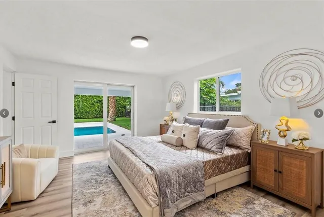 a bedroom with a bed and a couch