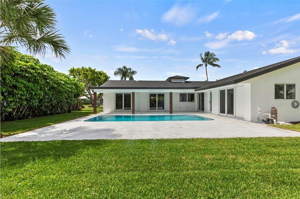 1365 Southwest 14th Street Boca Raton, FL 33486 - Photo 10 of 12 a front view of house with yard and green space