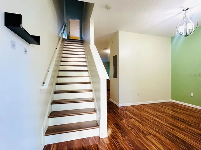 a view of entryway with wooden floor
