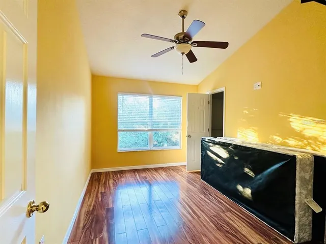 a view of room with wooden floor and window
