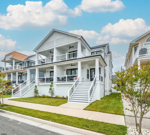 a front view of a house with a yard table and chairs