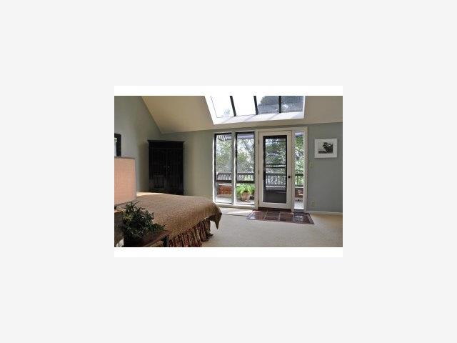 60 Hayfields Road Portola Valley, CA 94028 - Photo 7 of 9 a living room with a large window and a potted plant