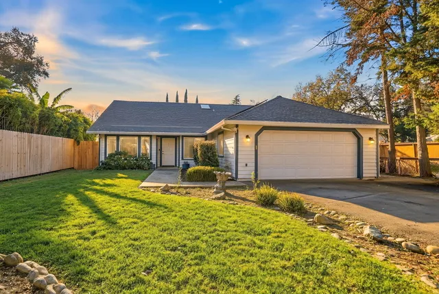 a view of a house with swimming pool and sitting area