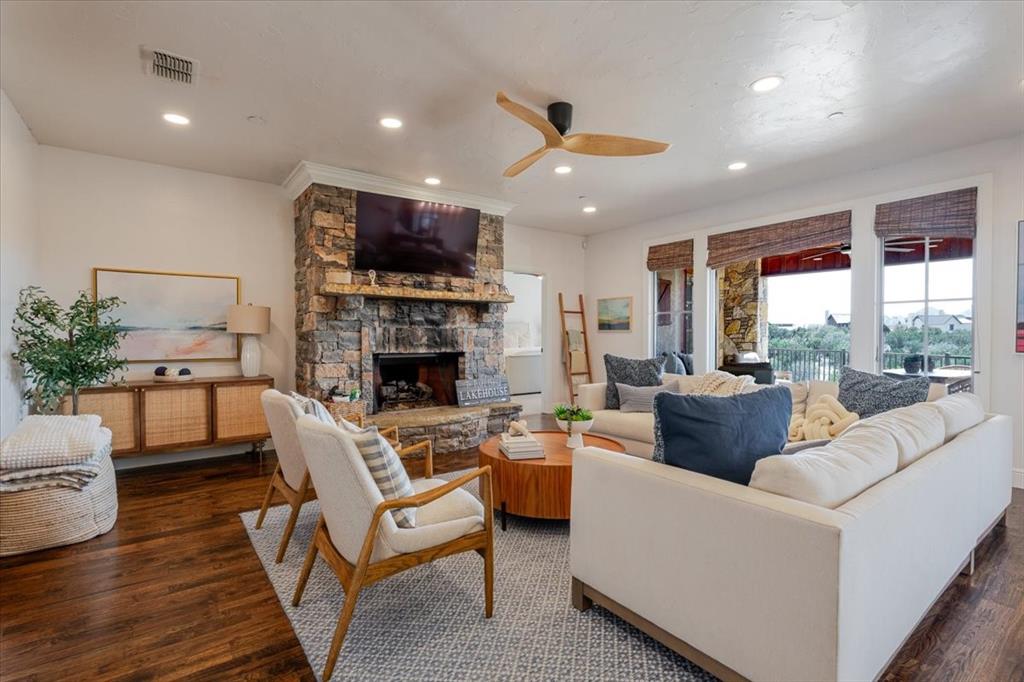 1653 Scenic Drive, Unit 102 Graford, TX 76449 - Photo 1 of 40 a living room with furniture fireplace and a large window