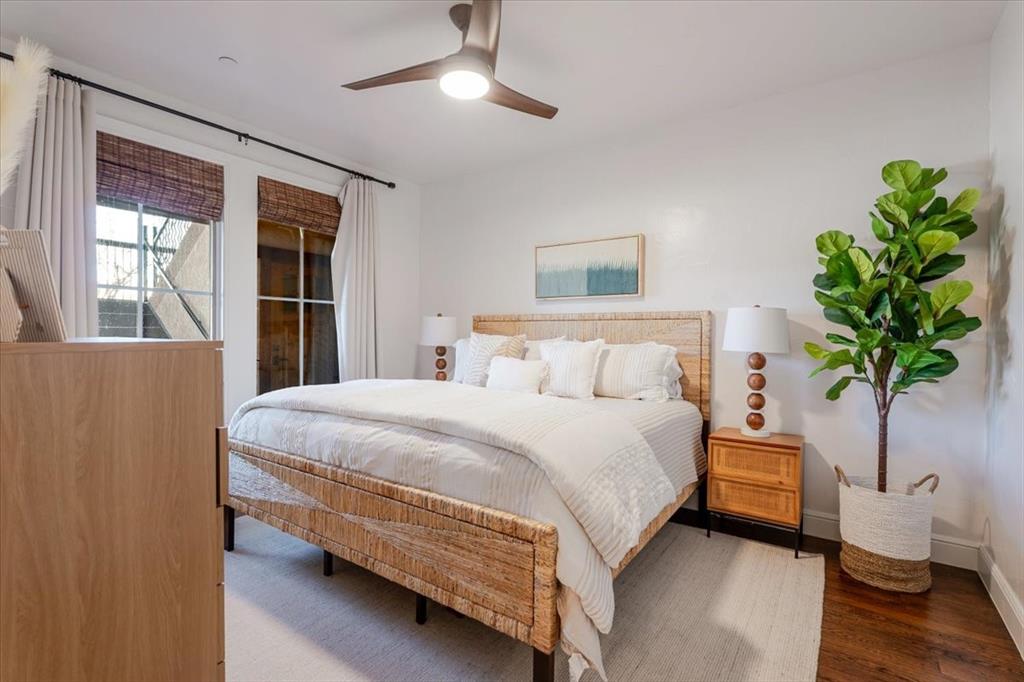 1653 Scenic Drive, Unit 102 Graford, TX 76449 - Photo 18 of 40 a bedroom with a bed and a potted plant