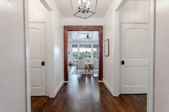 a view of a hallway view with wooden floor and staircase
