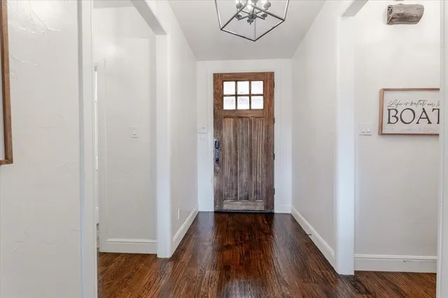 a view of front door with wooden floor