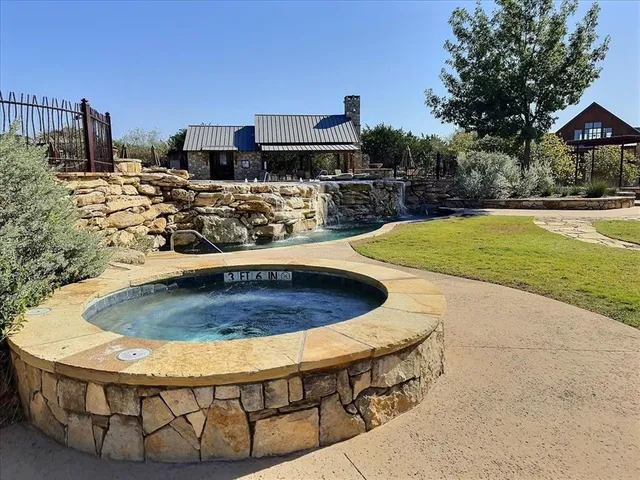 a view of a swimming pool with a patio