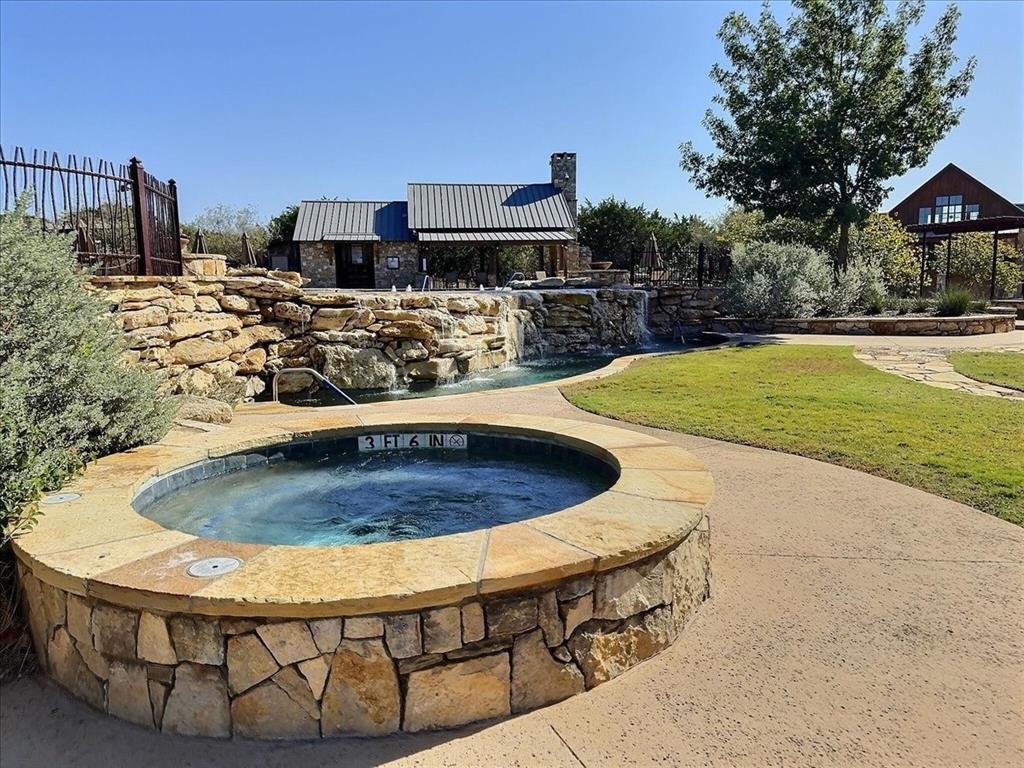 1653 Scenic Drive, Unit 102 Graford, TX 76449 - Photo 35 of 40 a view of a swimming pool with a patio