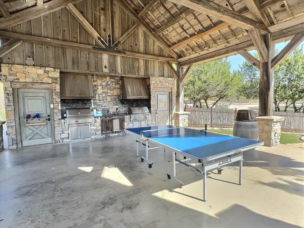 1653 Scenic Drive, Unit 102 Graford, TX 76449 - Photo 38 of 40 a room with lots of furniture and a chandelier