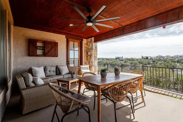 a view of a patio with a table and chairs