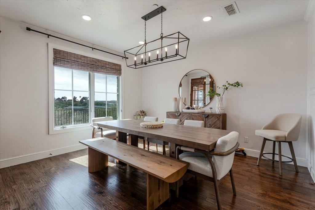 1653 Scenic Drive, Unit 102 Graford, TX 76449 - Photo 10 of 40 a view of a dining room with furniture window and wooden floor