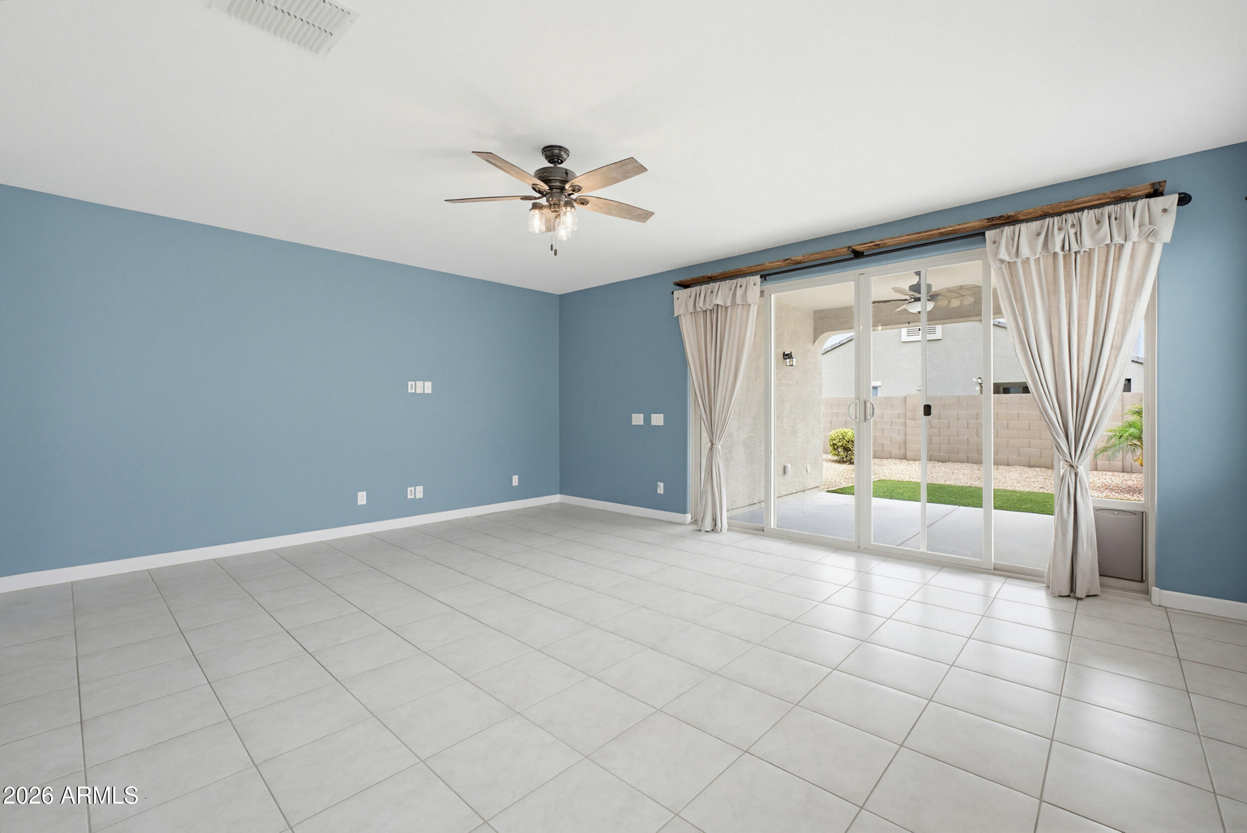19995 North Ben Court Maricopa, AZ 85138 - Photo 23 of 51 a view of an empty room with a window