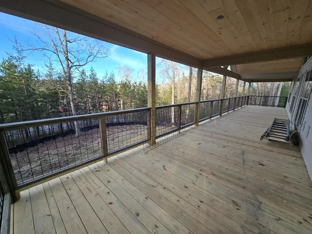 a view of outdoor space with wooden deck