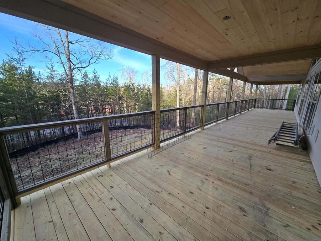 a view of outdoor space with wooden deck