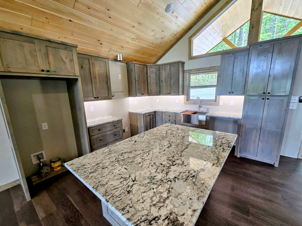 30 Small Street Blairsville, GA 30512 - Photo 14 of 36 a view of kitchen island with furniture and wooden floor