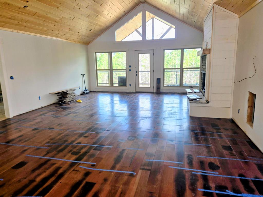 30 Small Street Blairsville, GA 30512 - Photo 21 of 36 an empty room with wooden floor and windows