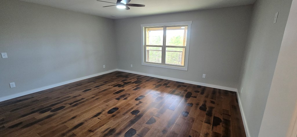 30 Small Street Blairsville, GA 30512 - Photo 26 of 36 an empty room with wooden floor and windows