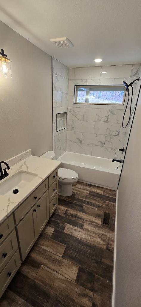 30 Small Street Blairsville, GA 30512 - Photo 34 of 36 a bathroom with a double vanity sink a toilet and a mirror