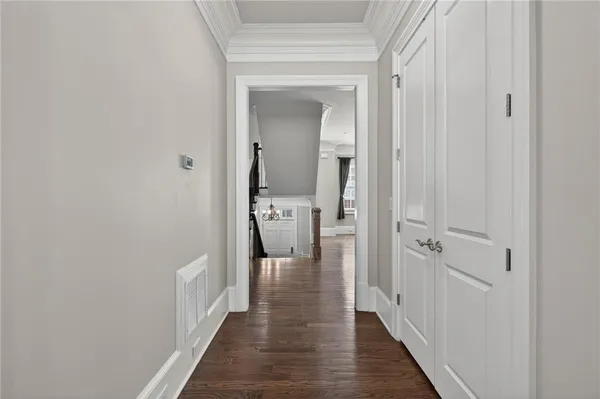 a view of a hallway with a wooden floor