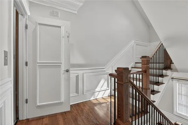 a view of entryway with wooden floor