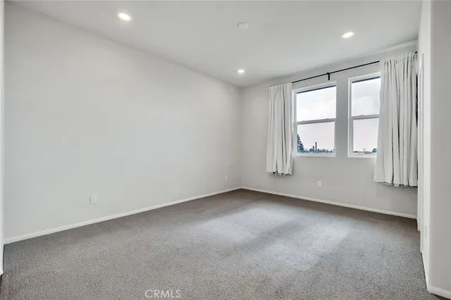 a bathroom with a double vanity sink a mirror and a shower