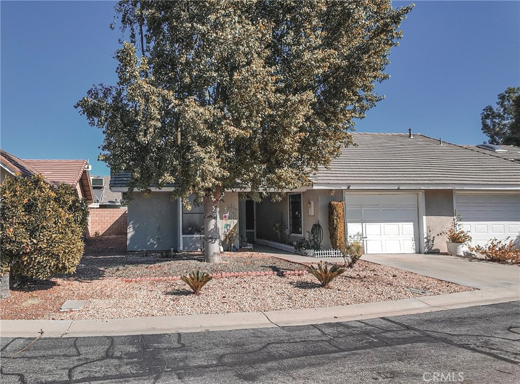 a view of a house with a yard and chandelier