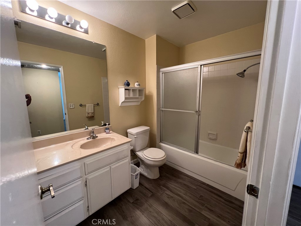 1419 Hancock Circle San Jacinto, CA 92583 - Photo 13 of 23 a bathroom with a double vanity sink toilet and shower