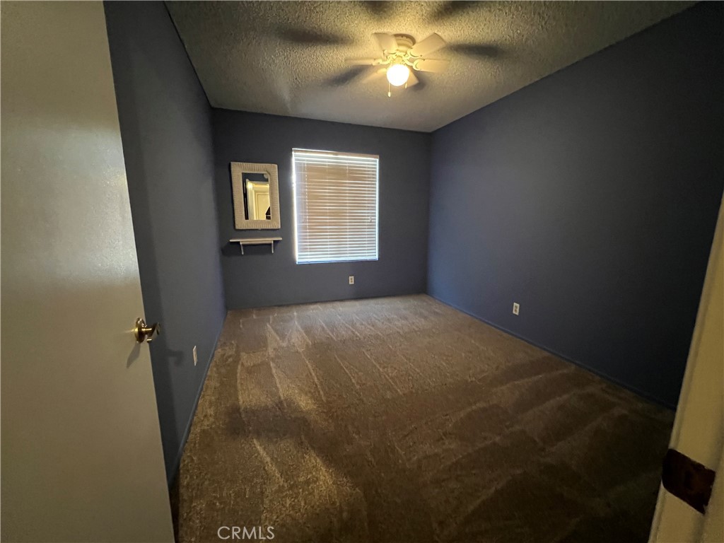 1419 Hancock Circle San Jacinto, CA 92583 - Photo 16 of 23 a view of an empty room with a window